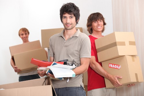 Professional packing team preparing household items for a move in Queensbury