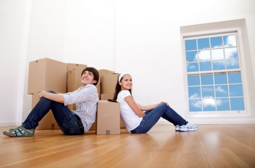 Local removals team handling furniture loading in Queensbury