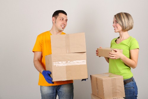 Packed boxes and furniture prepared for a Queensbury removals van